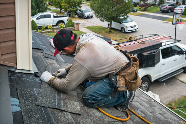Professional Roofing technician working in Millerton, IA